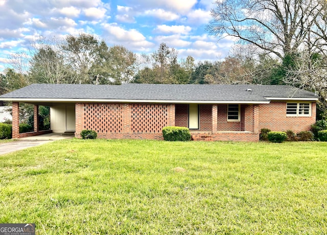 ranch-style house with a front yard and a carport