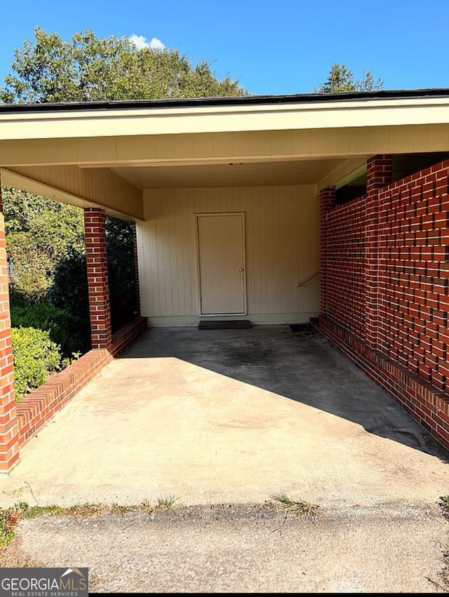 view of parking / parking lot featuring a carport