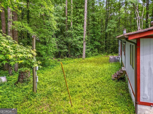 view of yard with central AC unit