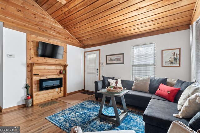 living room with hardwood / wood-style floors, wood ceiling, and lofted ceiling