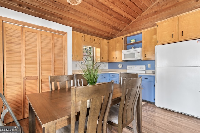 dining room featuring light wood-type flooring, wooden walls, lofted ceiling, and wood ceiling