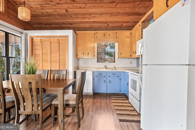 kitchen with wood ceiling, plenty of natural light, hanging light fixtures, and white appliances