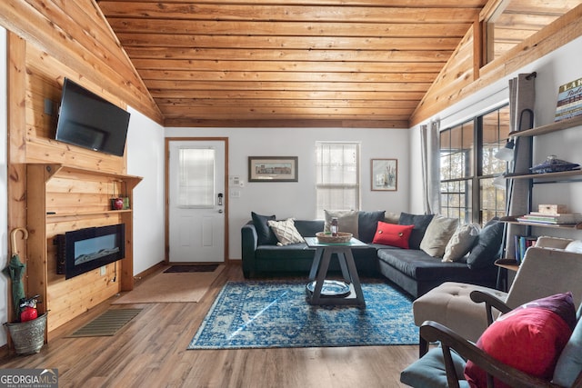 living room with wood-type flooring, vaulted ceiling, and wood ceiling