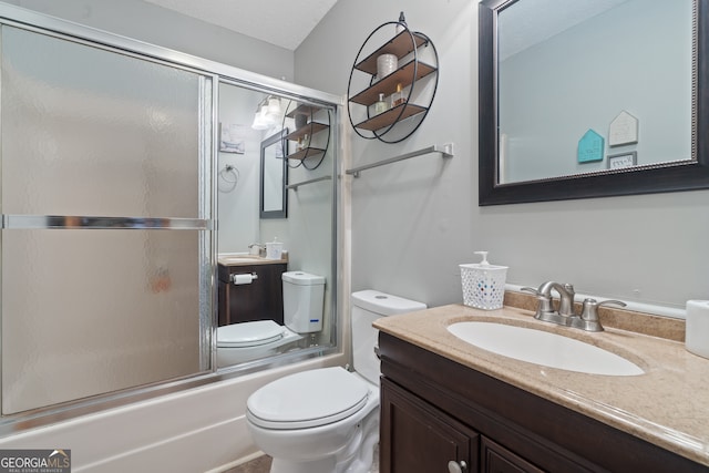 full bathroom with vanity, toilet, enclosed tub / shower combo, and a textured ceiling