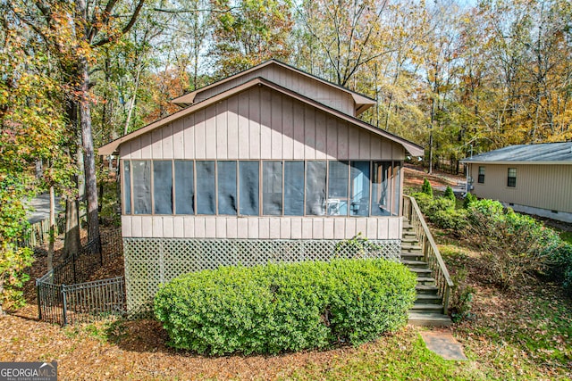 view of front of house with a sunroom