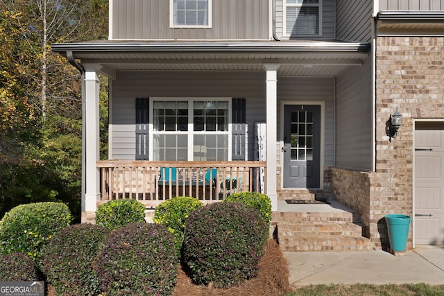 property entrance with covered porch