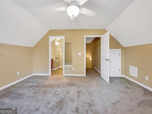 bonus room featuring light carpet, ceiling fan, and lofted ceiling