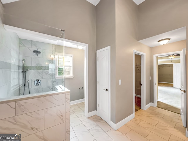 bathroom with tiled shower