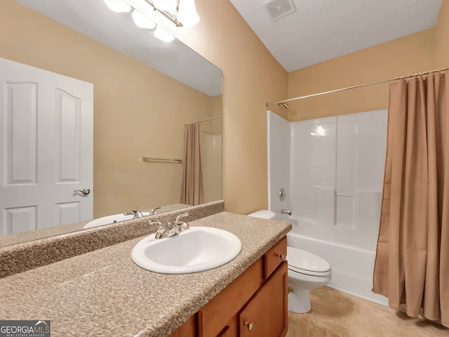 full bathroom with tile patterned flooring, vanity, toilet, and shower / bath combo