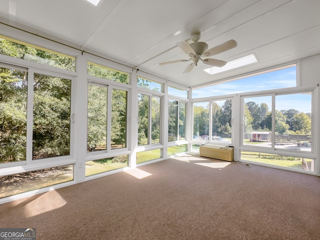 unfurnished sunroom featuring ceiling fan