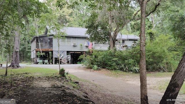 444 Harvey Rd, Bloomingdale, GA 31302 - rear view of house featuring a carport