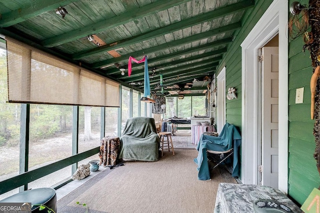 sunroom with vaulted ceiling with beams and wood ceiling