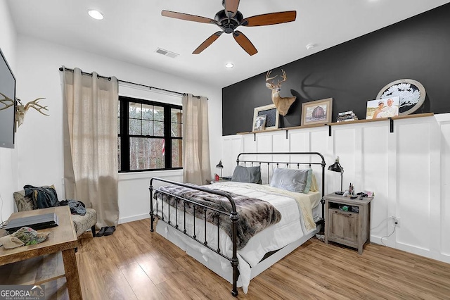 bedroom with wood-type flooring and ceiling fan