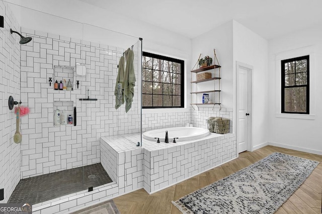 bathroom with wood-type flooring and independent shower and bath