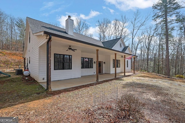 rear view of property featuring ceiling fan, a patio area, and central air condition unit