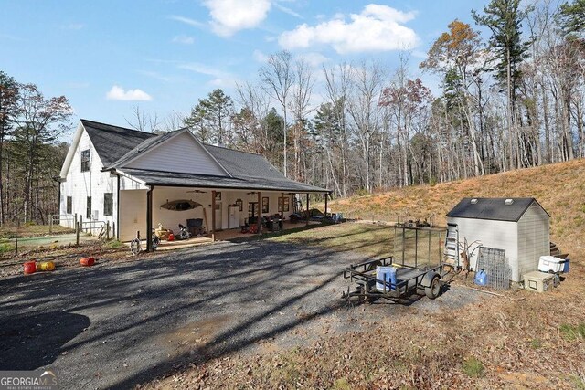 view of home's exterior featuring a storage unit