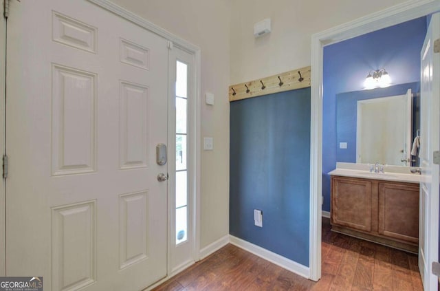 entryway with dark wood-type flooring and sink