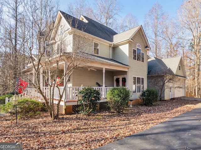 view of front of house featuring a garage and covered porch