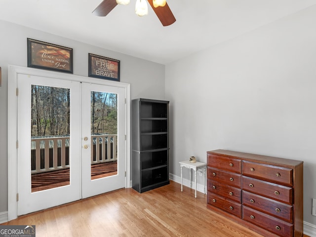 entryway with french doors, ceiling fan, light wood-style flooring, and baseboards