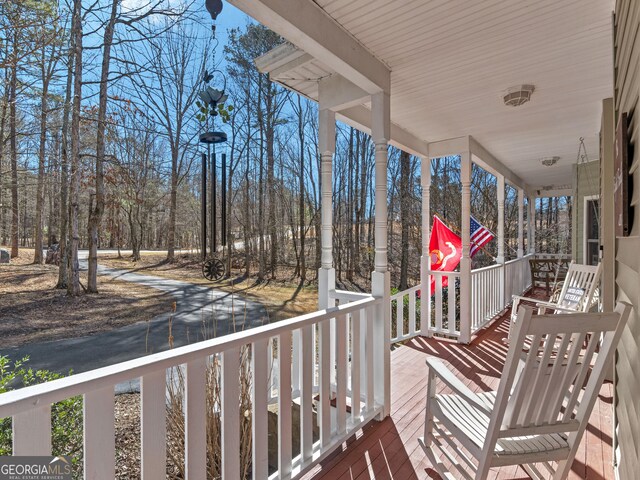 wooden deck featuring covered porch