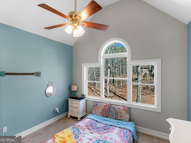 carpeted bedroom featuring lofted ceiling and ceiling fan