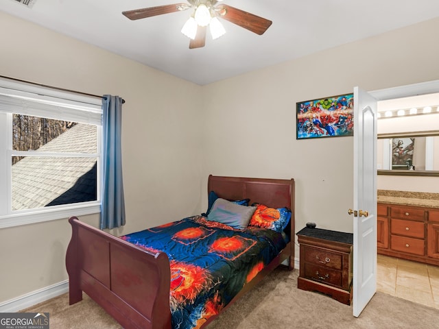 bedroom featuring a ceiling fan, light carpet, visible vents, and baseboards