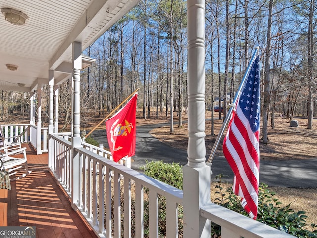 wooden deck featuring covered porch