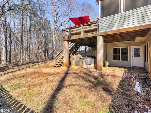 view of yard featuring a patio, stairway, and a wooden deck