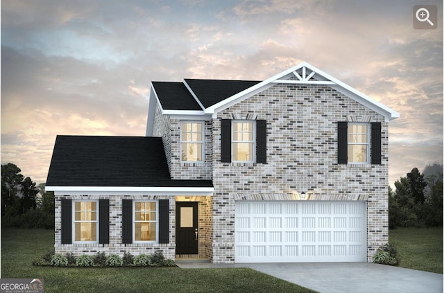 view of front of property with a garage and a lawn