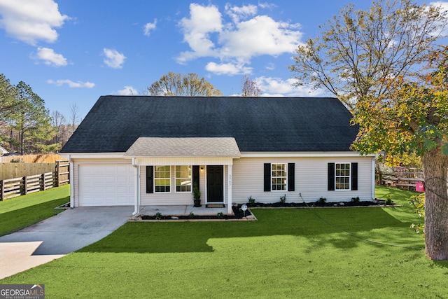 view of front of property featuring a garage and a front lawn