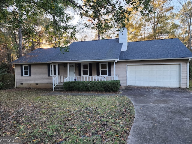 view of front facade featuring a porch and a garage