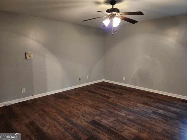 unfurnished room featuring ceiling fan and dark hardwood / wood-style flooring