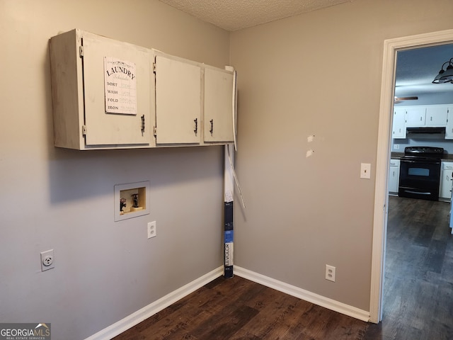 1751 Bridle Ln, Macon, GA 31220 - laundry area with hookup for an electric dryer, cabinet space, baseboards, dark wood-style floors, and hookup for a washing machine