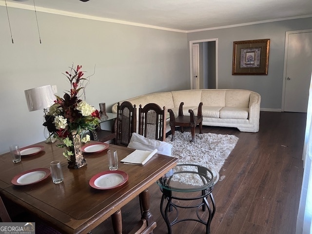 dining room featuring dark hardwood / wood-style floors and ornamental molding