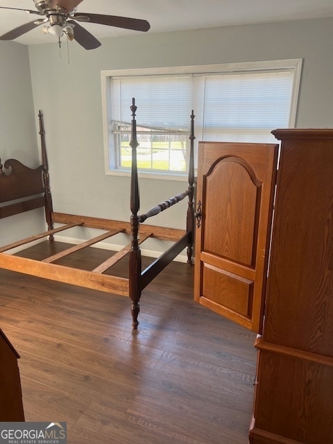 bedroom featuring dark hardwood / wood-style floors and ceiling fan