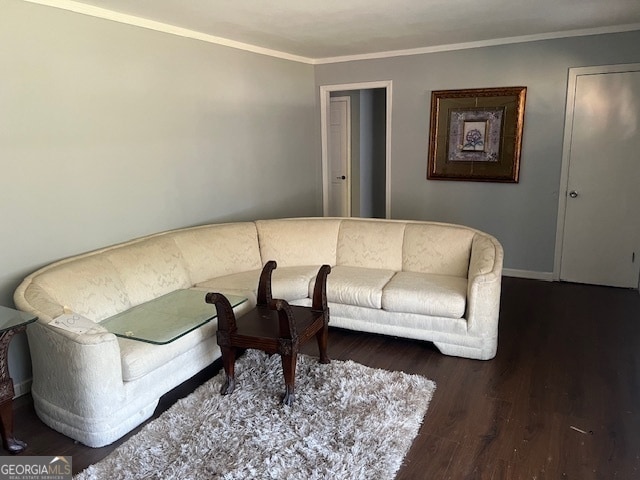 living room featuring crown molding and dark hardwood / wood-style flooring