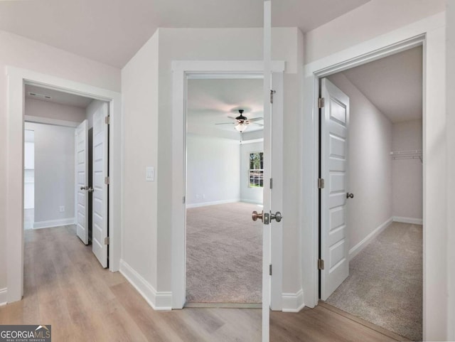 hall with light hardwood / wood-style flooring