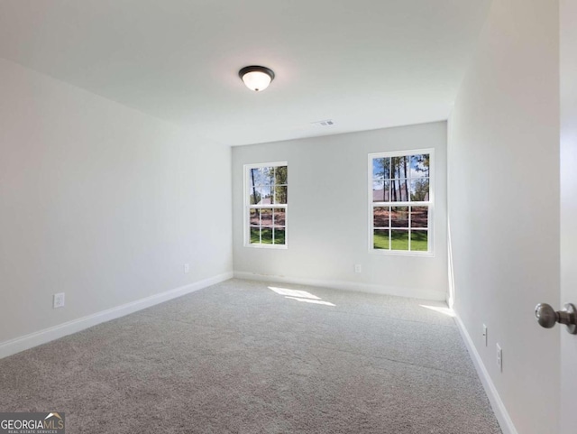 empty room featuring carpet floors