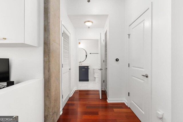 hallway featuring dark hardwood / wood-style floors