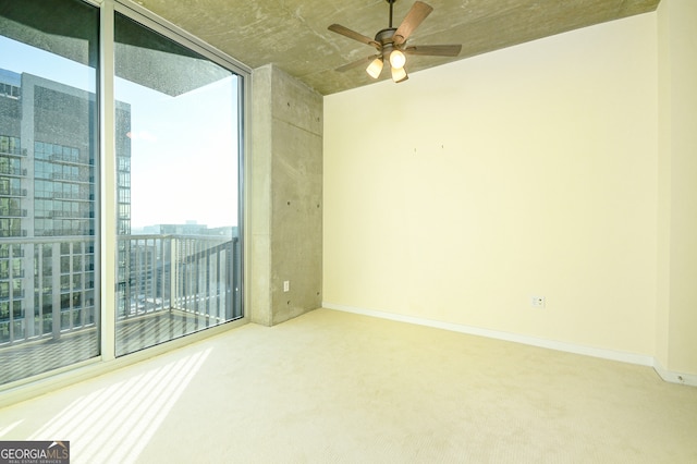 unfurnished room with carpet floors and ceiling fan