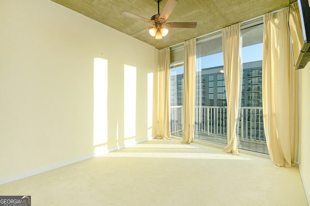 carpeted empty room with ceiling fan