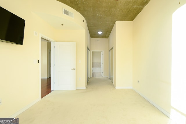 hallway with carpet flooring