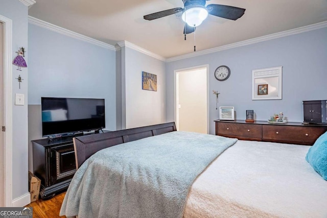 bedroom featuring ceiling fan, light hardwood / wood-style flooring, and ornamental molding