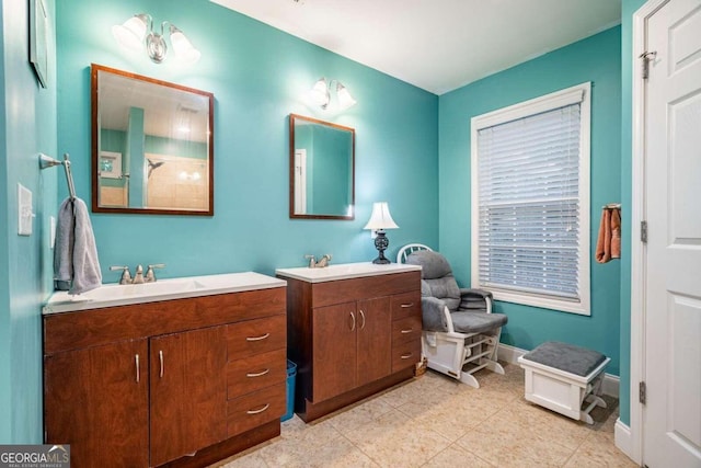 bathroom with tile patterned floors, a shower, and vanity