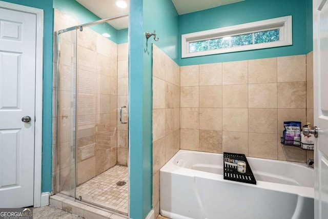 bathroom featuring tile patterned floors and plus walk in shower