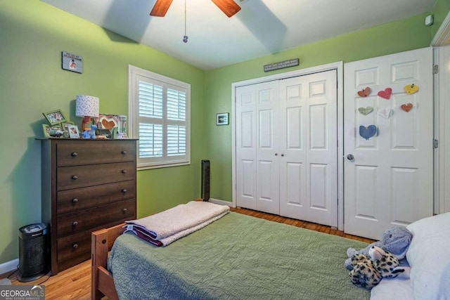 bedroom featuring ceiling fan, a closet, and light wood-type flooring