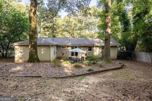 back of property with a patio area