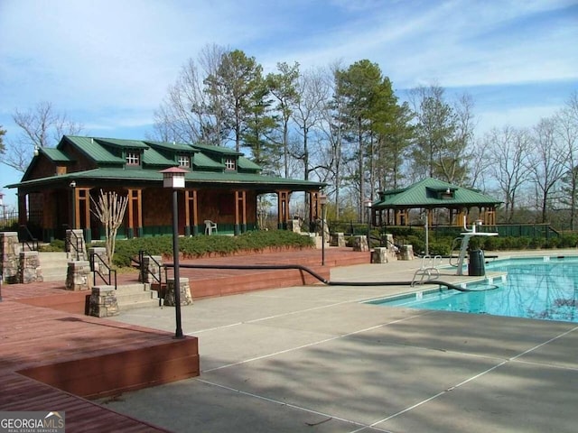 surrounding community with a gazebo and a swimming pool