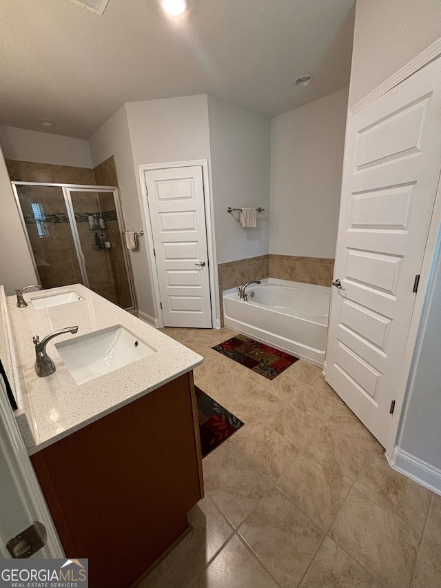 bathroom featuring vanity, tile patterned floors, and independent shower and bath