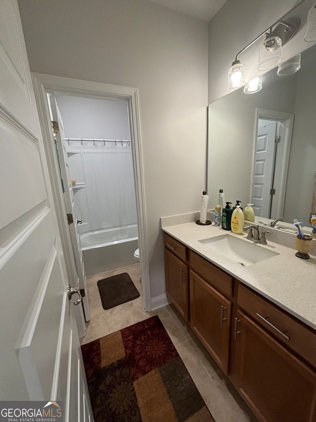 full bathroom with tile patterned floors, vanity, shower / bath combination, and toilet